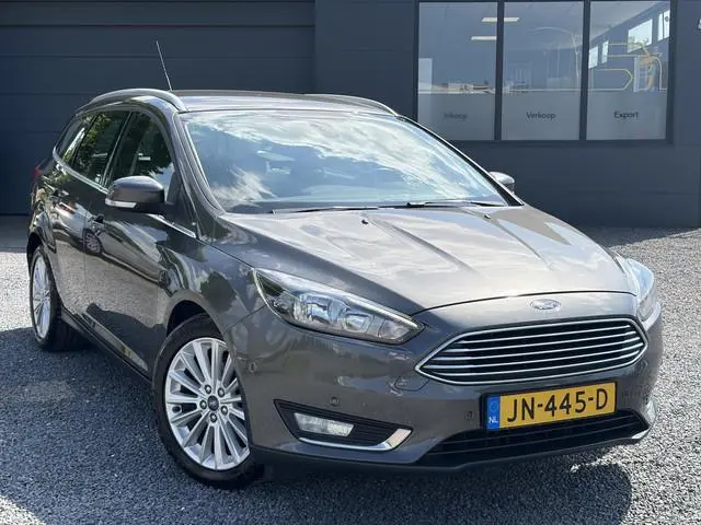 Ford Focus Wagon 1.0 Titanium 1e Eigenaar,Dealer Onderhouden,125pk,Navi,Trekhaak,6 Bak,Clima,Cruise,...