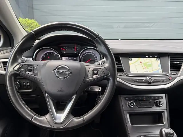 Opel Astra Sports Tourer 1.4 Turbo 120 Jaar Edition ✓150pk✓Carplay✓Navi✓Trekhaak✓Pdc V+A✓Clima✓Cruis...
