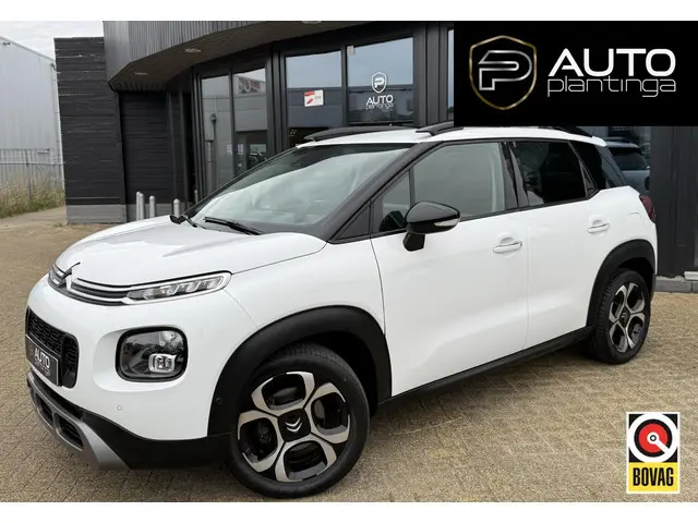 Citroen C3 Aircross 1.2 PureTech S&S Shine 110PK | ZEER NETTE STAAT! | Dealeronderhouden | Trekhaak | Achteruitrijcamera | Grip Control | Head-up Display | Parkeersensoren Voor & Achter | Keyless Entry | Stoelverwarming | Navigatie |