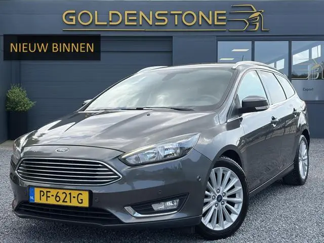 Ford Focus Wagon 1.0 Titanium 2e Eigenaar,Navi,Trekhaak,125pk,Clima,Cruise,Pdc V+A,6 Bak,Lm velgen,N...