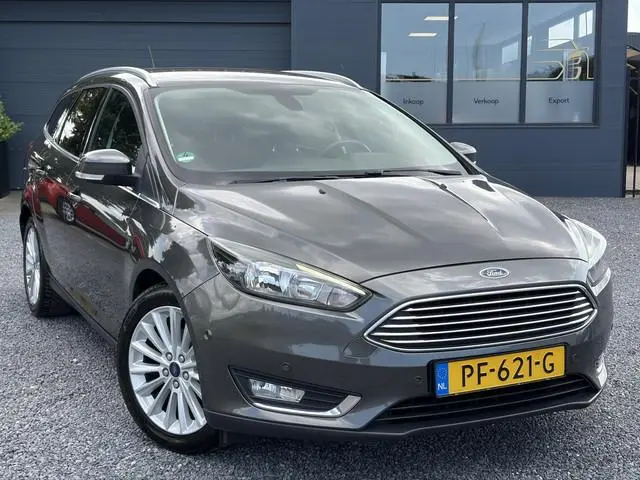 Ford Focus Wagon 1.0 Titanium 2e Eigenaar,Navi,Trekhaak,125pk,Clima,Cruise,Pdc V+A,6 Bak,Lm velgen,N...