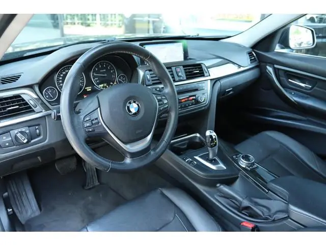 BMW 3-SERIE 316I HIGH EXECUTIVE AUT. | LEDER | NAVI | STOELVERW. | PDC | LMV